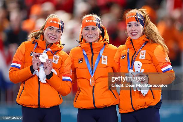 Silver medalist Joy Beune, Marijke Groenewoud and Antoinette Rijpma-de Jong of Team Netherlands celebrate on the podium during the medal ceremony for...