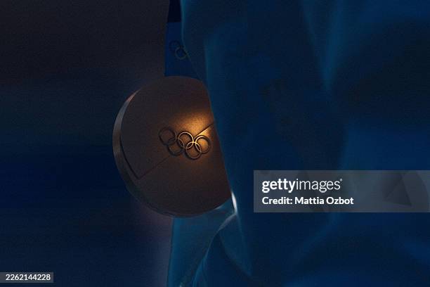 Close-up view of a gold medal held by Federica Brignone of Team Italy during the medal ceremony for the Women's Giant Slalom on day nine of the...