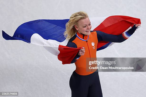 Xandra Velzeboer of Team Netherlands celebrates after winning gold in the finals of the Short Track Speed Skating Women's 1000m on day ten of the...