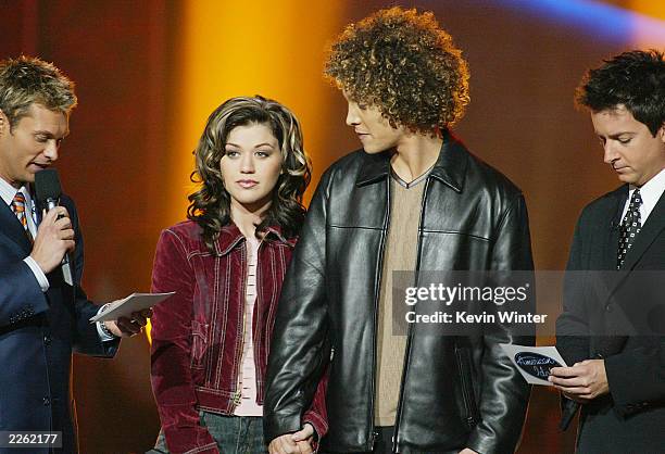 Hosts Ryan Seacrest and Brian Dunkleman with Kelly Clarkson and Justin Guarini before the announcement of the winner of American Idol at the Kodak...