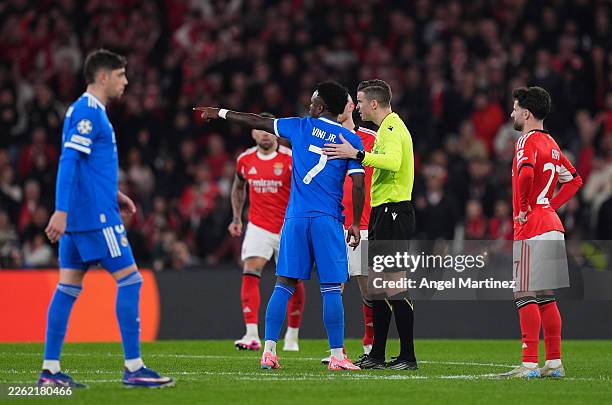 Vinicius Junior of Real Madrid speaks to referee Francois Letexier during the UEFA Champions League 2025/26 League Knockout Play-off First Leg match...