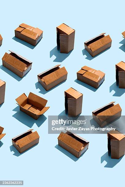 cardboard boxes pattern on a blue background - box pattern stock pictures, royalty-free photos & images