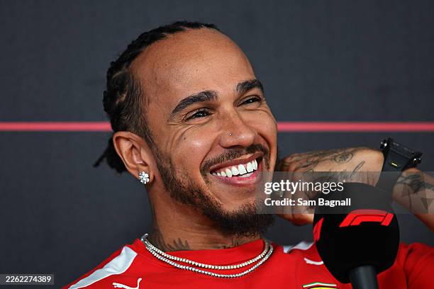 Lewis Hamilton of Great Britain and Scuderia Ferrari talks in the Drivers Press Conference during day one of F1 Testing at Bahrain International...