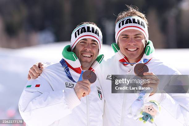 Bronze medalists Elia Barp and Federico Pellegrino of Team Italy pose for a photo from the podium during the medal ceremony for Men's Team Sprint...