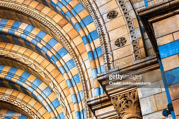 abstract façade of natural history museum in london, uk - natural history museum london stock pictures, royalty-free photos & images