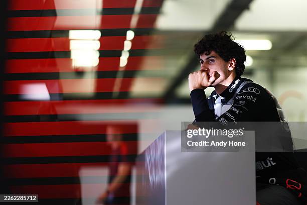Gabriel Bortoleto of Brazil and Audi F1 Team looks on in the garage during day one of F1 Testing at Bahrain International Circuit on February 18,...