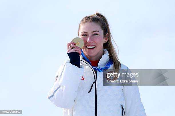 Gold medalist Mikaela Shiffrin of Team United States celebrates on the podium during the medal ceremony following the Women's Slalom Run on day...