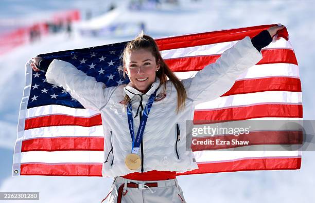 Gold medalist Mikaela Shiffrin of Team United States poses for a photo with a flag after the medal ceremony following the Women's Slalom Run on day...