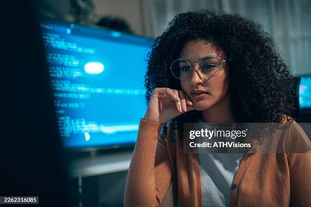 latin woman programmer working on software development project - python code stock pictures, royalty-free photos & images
