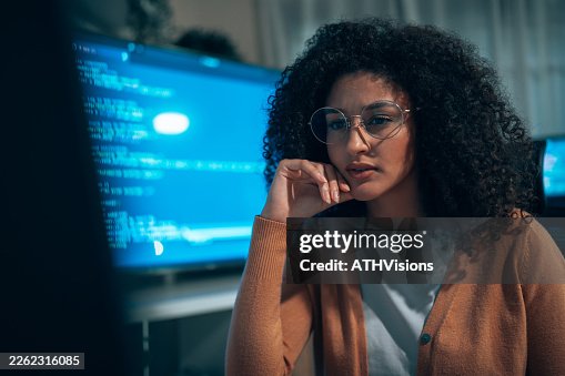 Latin woman programmer working on software development project Latin woman programmer working on software development project