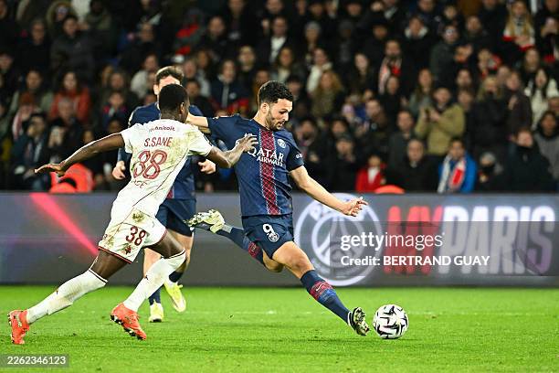 Paris Saint-Germain's Portuguese forward Goncalo Ramos shoots to score his team's third goal during the French L1 football match between Paris...