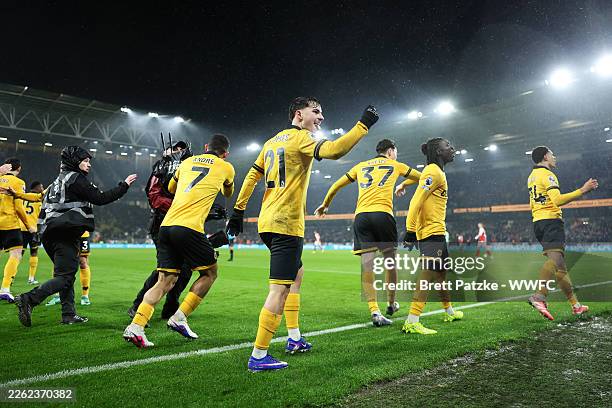 Rodrigo Gomes and teammates of Wolverhampton Wanderers celebrate after Tom Edozie of Wolverhampton Wanderers scores his team's second goal during the...