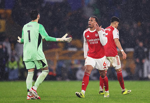 David Raya and Gabriel of Arsenal clash after Tom Edozie of Wolverhampton Wanderers scores his team's second goal during the Premier League match...
