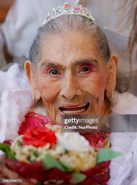Year-old woman in Mexico City, Mexico, on February 21 smiles before dancing a waltz to celebrate her quinceanera, one of the most significant...
