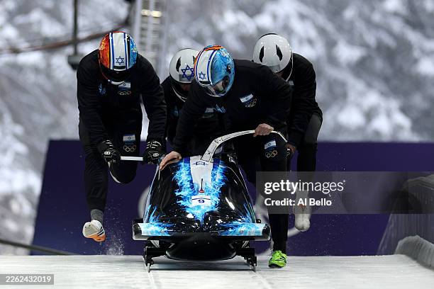 Adam Edelman of Team Israel pilots his team as they participate in 4-man Bobsleigh training on day thirteen of the Milano Cortina 2026 Winter Olympic...