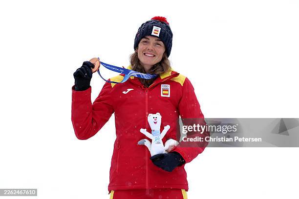 Bronze medalist Ana Alonso Rodriguez of Team Spain celebrates on the podium during the medal ceremony for the Ski Mountaineering Women's Sprint on...