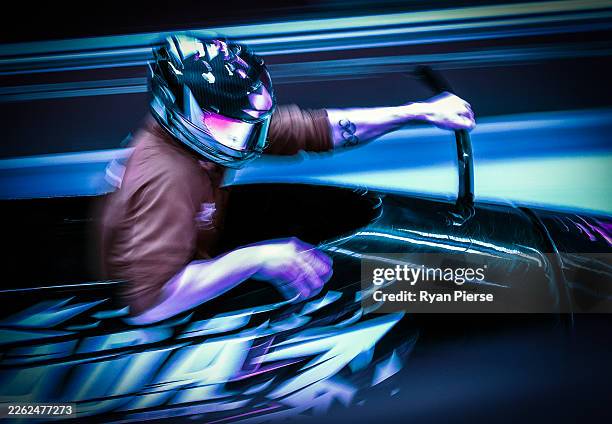 Jay Dearborn of Team Canada pilots his team as they participate in heat three of the 4-man Bobsleigh training on day thirteen of the Milano Cortina...