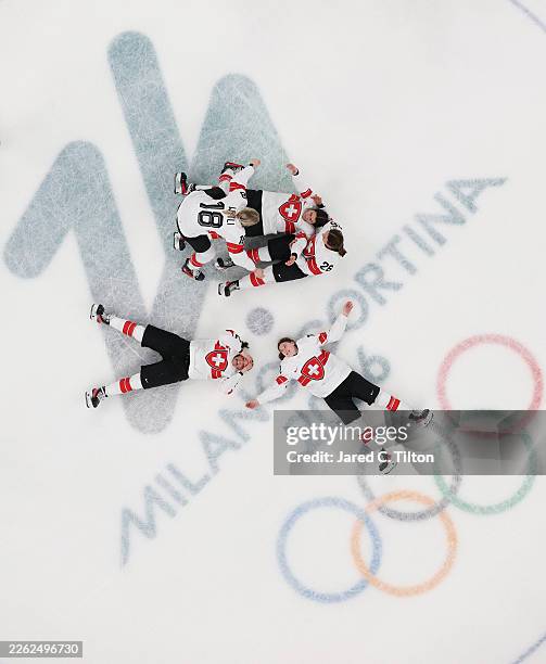 Players of Team Switzerland celebrate winning the bronze medals after the team's 2-1 overtime victory in the Women's Bronze Medal match between...