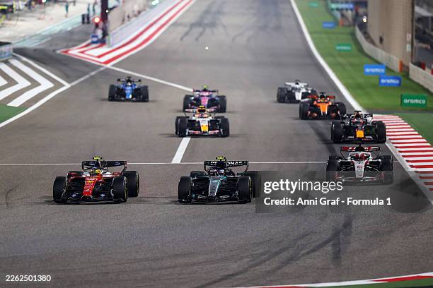 Andrea Kimi Antonelli of Italy driving the Mercedes AMG Petronas F1 Team W17 leads Lewis Hamilton of Great Britain driving the Scuderia Ferrari SF-26...