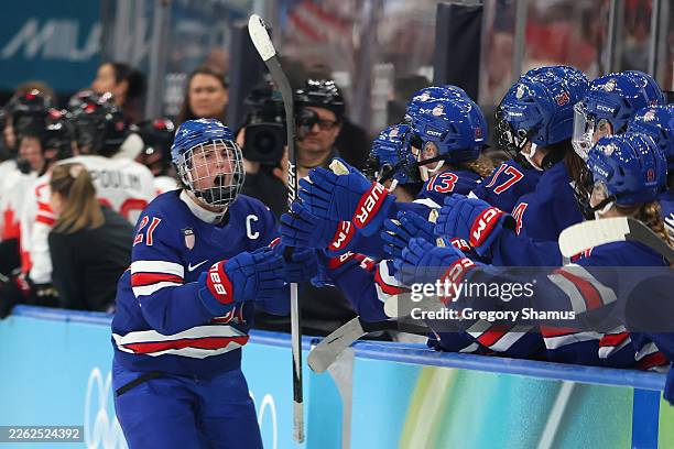 Hilary Knight of Team United States celebrates with teammates after scoring a goal in the third period during the Women's Gold Medal match between...