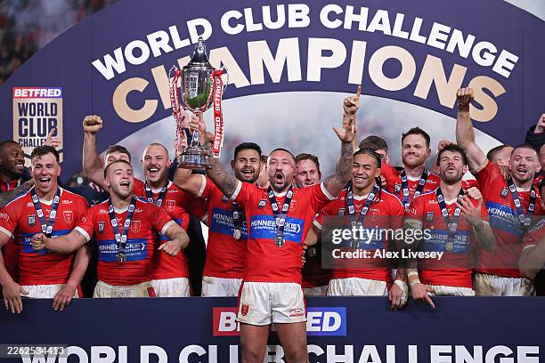 Elliot Minchella, Captain of Hull KR lifts the World Club Challenge Cup after victory over Brisbane Broncos in the World Club Challenge match between...