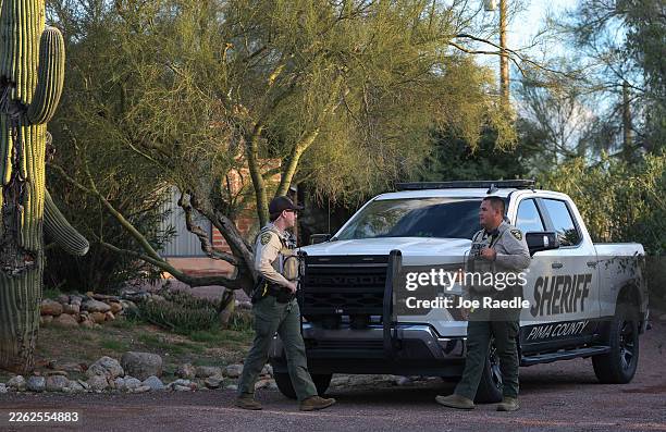 Pima County Sheriff's deputies are seen in front of Nancy Guthrie's residence during a shift change on February 19 in Tucson, Arizona. Law...