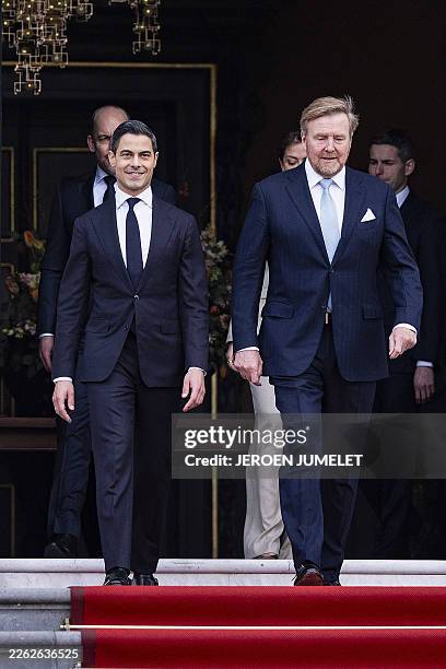 Netherlands' new Prime minister Rob Jetten and Netherlands' Willem-Alexander appear on the top of the steps ahead of the family photograph as part of...