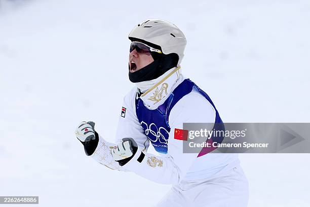Xindi Wang of Team People's Republic of China reacts after competing in Final Two of the Men's Aerials Final on day fourteen of the Milano Cortina...