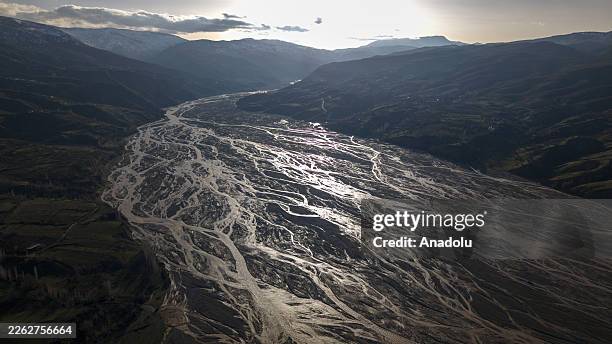 An aerial view of the Siro Stream, which carries meltwater from the surrounding mountains along a route of approximately 30 kilometers before flowing...