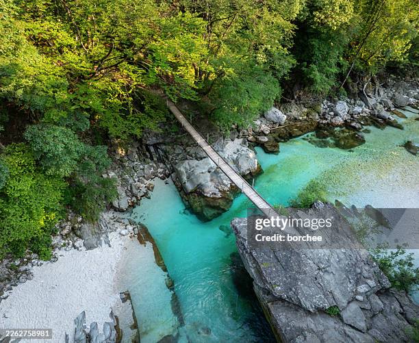 aerial view of wooden bridge over turquoise soca river - balkans stock pictures, royalty-free photos & images