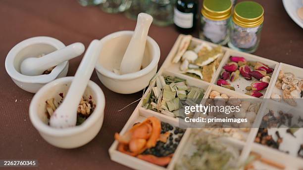 traditional herbal medicine ingredients natural herbal remedy setup with dried herbs and spices for alternative medicine - herbal medicine stock pictures, royalty-free photos & images
