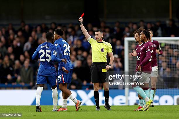 Wesley Fofana of Chelsea is shown a red card by match referee Lewis Smith during the Premier League match between Chelsea and Burnley at Stamford...