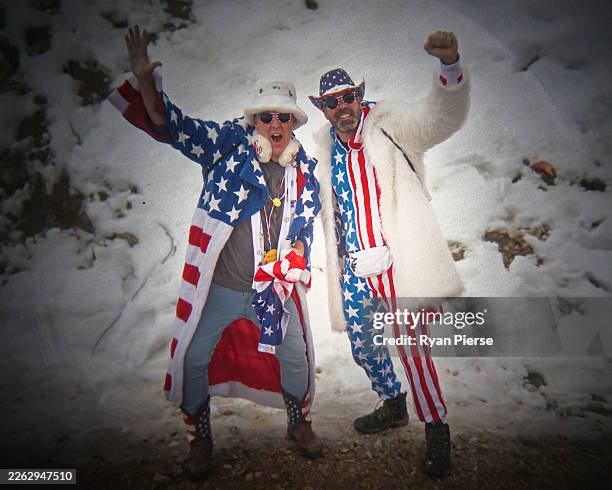 Fans of Team United States pose prior to the Bobsleigh Four-Man Heat 4 on day 16 of the Milano Cortina 2026 Winter Olympic games at Cortina Sliding...