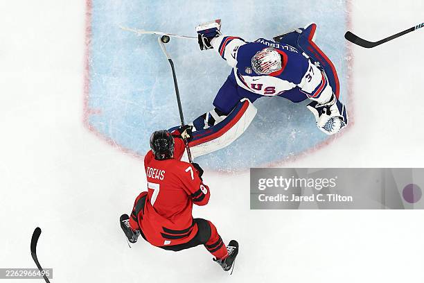 Image Sandgi Connor Hellebuyck of Team United States saves the shot taken by Devon ...