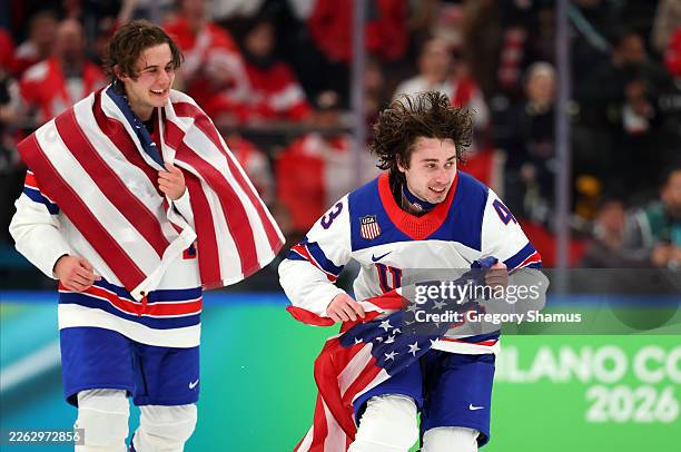 Jack Hughes and Quinn Hughes of Team United States celebrate winning the gold medals after the team's 2-1 overtime victory in the Men's Gold Medal...