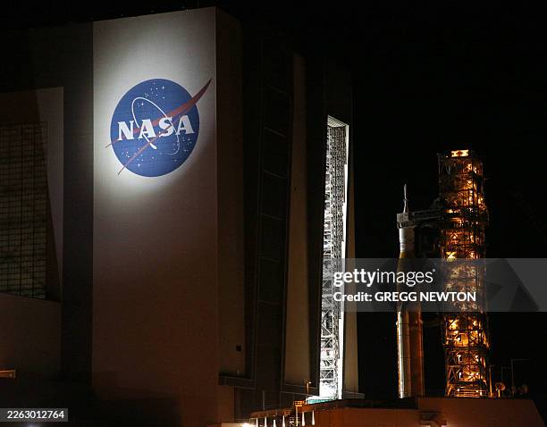 Mobile launcher 1 containing the massive Artemis II Space Launch System rocket and Orion spacecraft arrives at the Vehicle Assembly Building from...