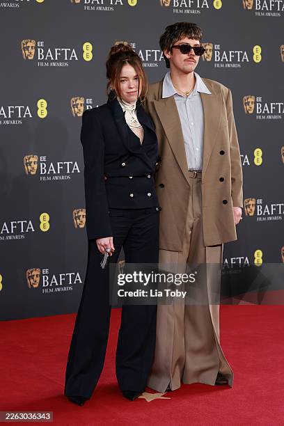 Milly Alcock and Joseph Powell attend the 2026 EE BAFTA Film Awards at The Royal Festival Hall on February 22, 2026 in London, England.