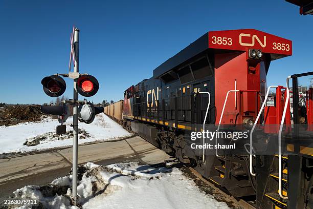 cn rail locomotive - railroad crossing stock pictures, royalty-free photos & images