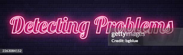detecting problems - glowing neon text on brick wall background - light sensor stock illustrations