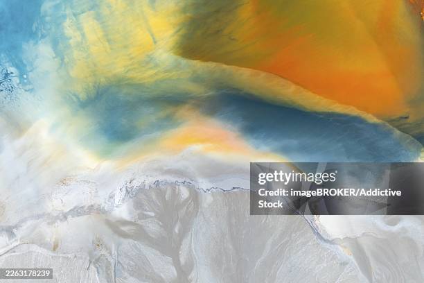 a vibrant abstract texture featuring a blend of multicolor swirls and organic patterns rich blues, yellows, and oranges create a vivid, dynamic flow that evokes natural phenomena - perfect blend stock illustrations