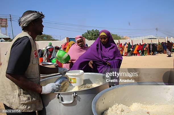 Charity organizations distribute iftar meals to people in need during holy month of Ramadan, where prolonged drought and economic hardship continue...