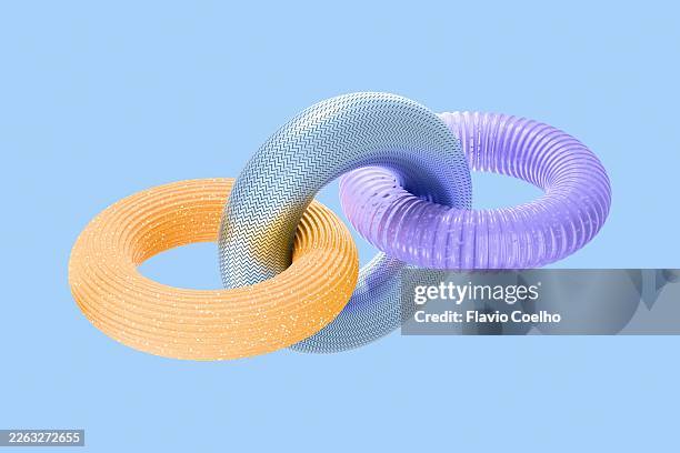 torus shapes linked together - interlocked stock pictures, royalty-free photos & images