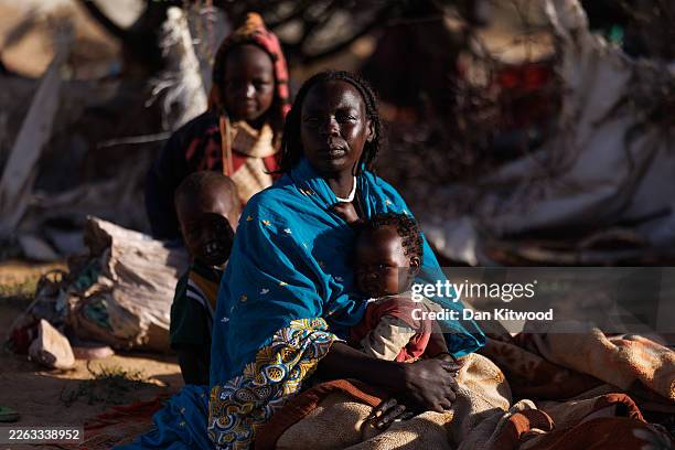 Recently arrived Sudanese refugees sit in their temporary shelter at the Oure Cassoni refugee camp after arriving from Sudan, on February 24, 2026 in...