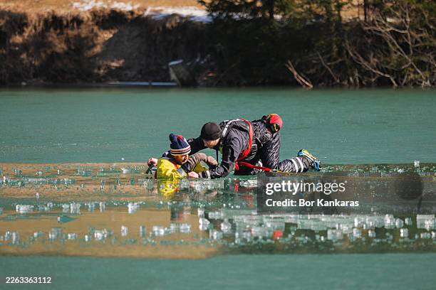 rescue team training on frozen lake - rescue worker stock pictures, royalty-free photos & images