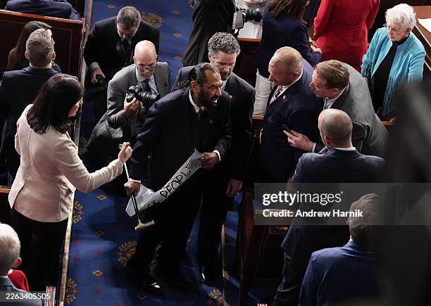Troy Nehls and Pat Fallon argue with ejected Rep. Al Green as Trump delivers his State of the Union address during a Joint Session of Congress at the...