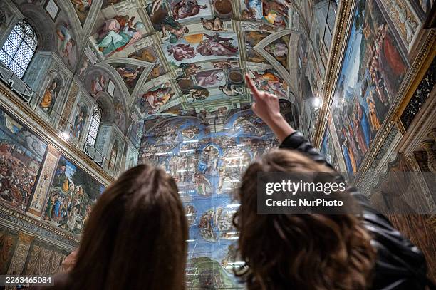 Visitors look up inside the Sistine Chapel in Vatican City, Vatican, on February 28, 2026. Michelangelo's Last Judgement undergoes extraordinary...