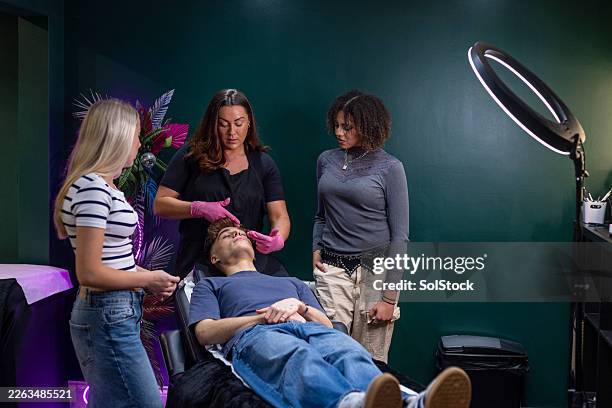 learning a beautician skill - threading eyebrows stock pictures, royalty-free photos & images