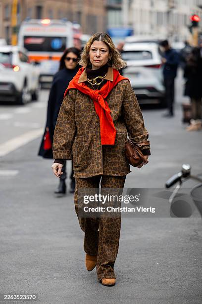 Guest wears animal print oversized jacket, pants brown bag outside Luisa Beccaria during the Milan Fashion Week - Womenswear Fall/Winter 2026/2027 on...
