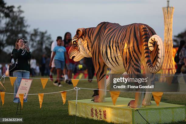 Visitors enjoy the display during the Auckland Lantern Festival held at the Manukau Sports Bowl on February 26, 2026 in Auckland, New Zealand. First...