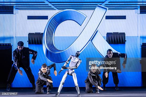 Humanoid robot, by Honor Device Co., dances with human dancers during a presentation ahead of MWC Barcelona 2026 in Barcelona, Spain, on Sunday,...